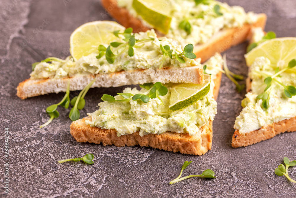 Toasts with avocado pate and fresh microgreen