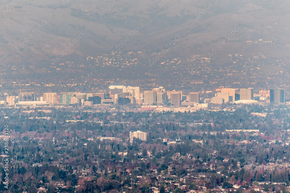 Aerial view of downtown San Jose on a sunny afternoon; Silicon Valley, south San Francisco bay area, California; pollution and smog visible in the air