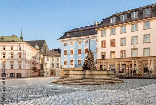 Olomouc old town with Caesar's Fountain and  historical buildings on Horni Namesti (Upper Square in Czech) in the morning