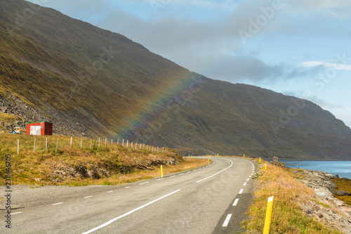 Rainbow over fjord in west fjords region, Iceland