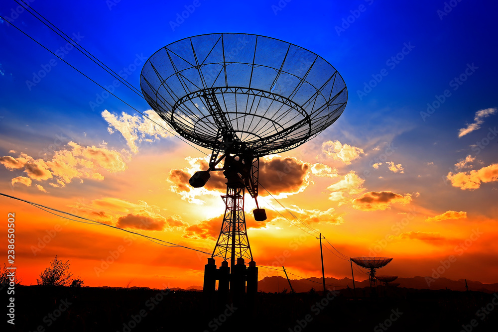 The silhouette of a radio telescope observatory The silhouette of a radio telescope observatory