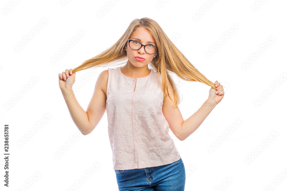 sexy young blond woman in glasses with a smile on her face holds her hair with both hands with her hands apart, woman's emotions, shooting on an isolated background sexy young blond woman in glasses with a smile on her face holds her hair with both hands with her hands apart, woman's emotions, shooting on an isolated background