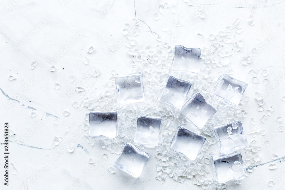 Bar desk with ice cubes on marble background top view space for text Bar desk with ice cubes on marble background top view space for text