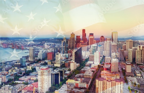 American flag on city background.