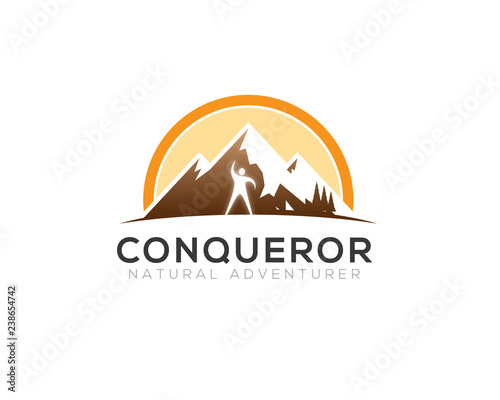 man standing lifting hand in front of mountain