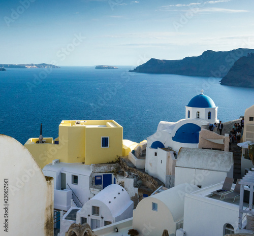 White architecture and blue dome churches in Oia  Santorini island  Greece