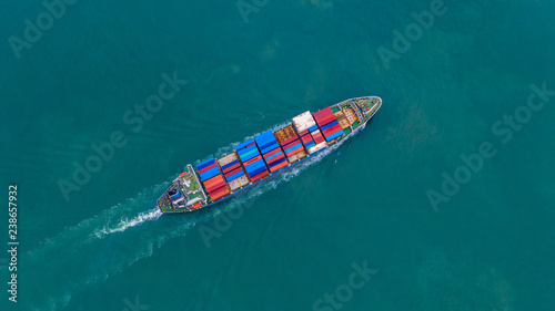 Aerial view container ship carrying container for import and export, business logistic and freight transportation by ship in open sea.