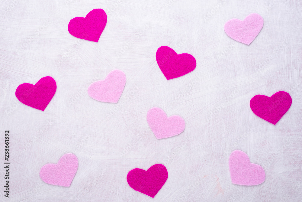 Background with hearts made of pink felt