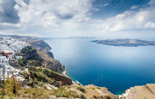 Seascape and classical white architecture of Oia town; Santorini island; Greece