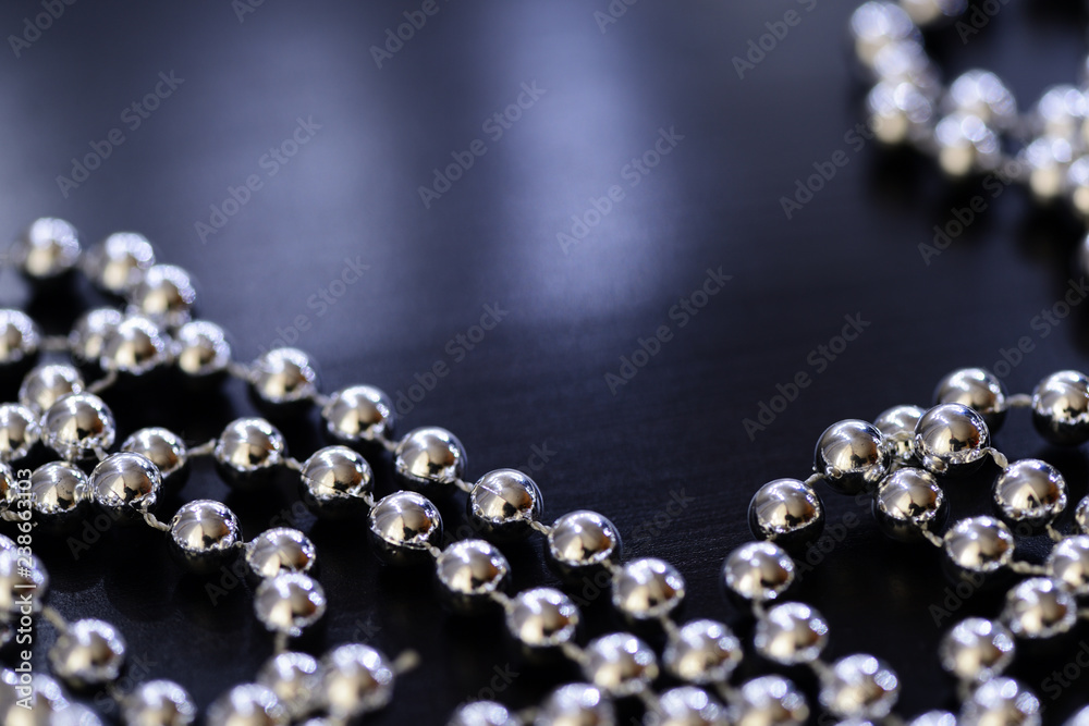 Silver Christmas decoration on a dark background close up Silver Christmas decoration on a dark background close up