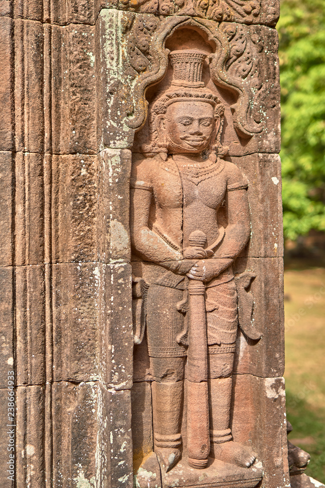Apsara relief on the wall of the Vat Phou temple complex sanctuary