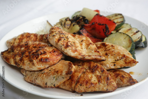 Grilled chicken breast with vegetables on the plate