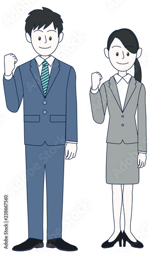 やる気のガッツポーズをする若い男性と女性ビジネスマン