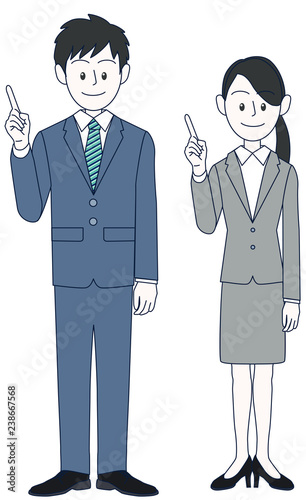 指でポイントを指し示す若い男性と女性のビジネスマン