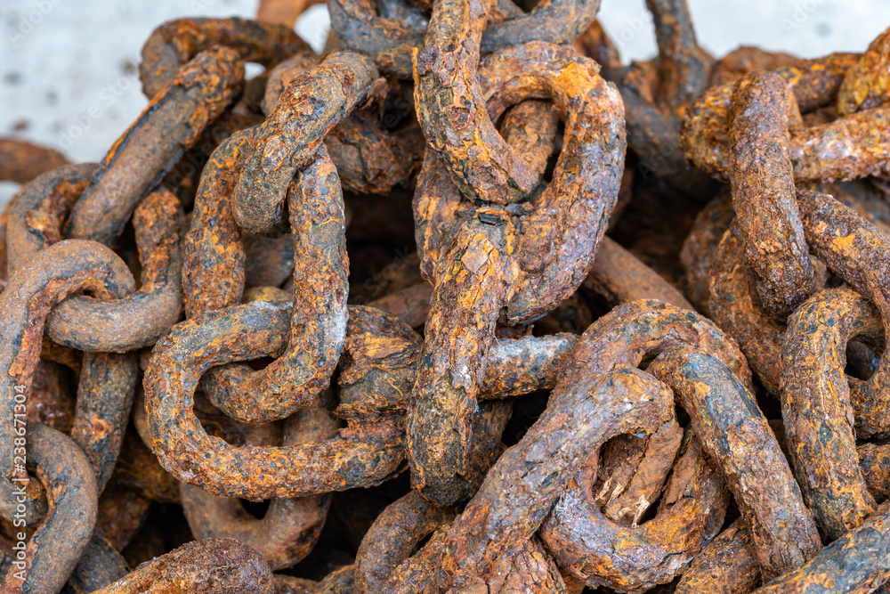 Rusty chains eroded by sea water Rusty chains eroded by sea water