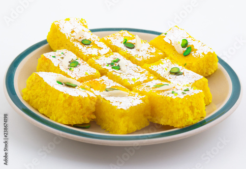 Indian Popular Sweet Food Khopara Pak or Coconut Burfi made up of Coconut, Milk And Sugar Isolated on White Background photo