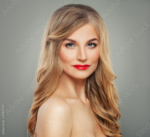 Blondie woman with long blonde hair and red lips makeup