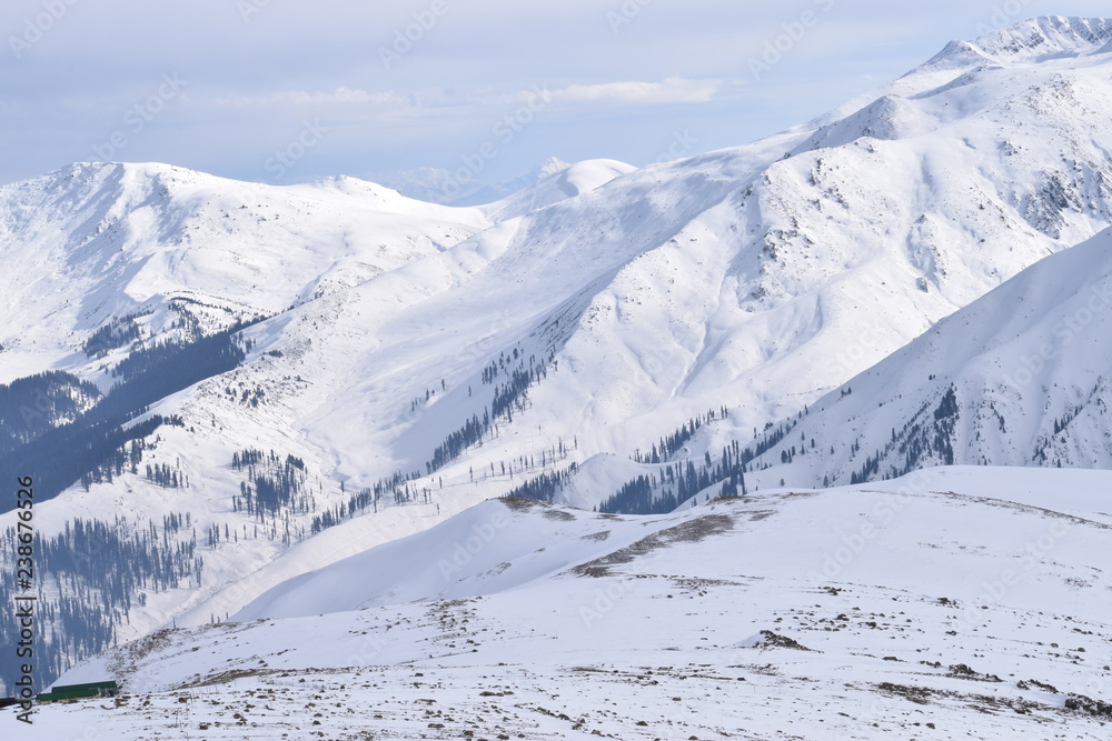Mount Apharwat at a height of 4390 metres in Gulmarg, Kashmir, India. It lies in Pir Panjal mountain range in Indian Himalayas. It remains covered with heavy snow throughout the year.