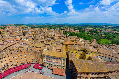 Piazza del Campo, Siena - Aerial view of the historic town with beautiful landscape scenery on a sunny summer day in Tuscany, walled medieval hill town with towers in the province of Siena, Italy