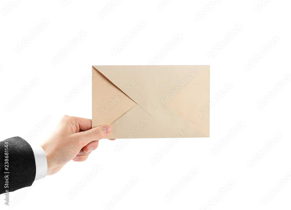 Fototapeta premium The hand in white shirt and black jacket holding the envelope. Close up. Isolated on white background