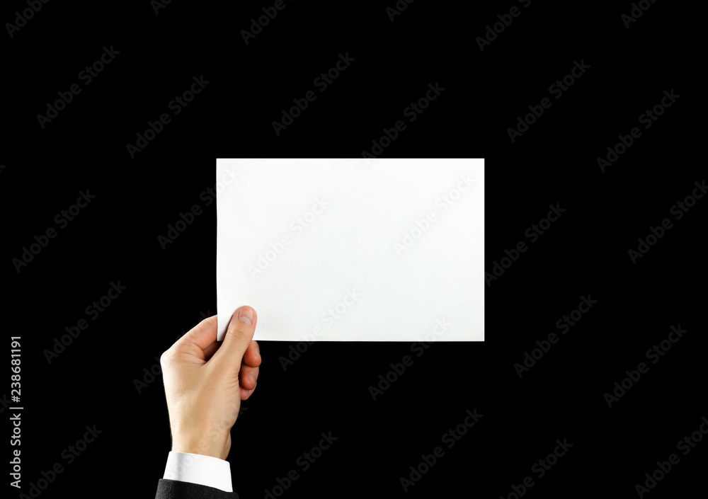 Hand holding blank brochure booklet in the hand. Isolated on black background. Man show offset paper. Sheet template. Book in hands. Booklet folding design. Fold paper sheet display read Hand holding blank brochure booklet in the hand. Isolated on black background. Man show offset paper. Sheet template. Book in hands. Booklet folding design. Fold paper sheet display read