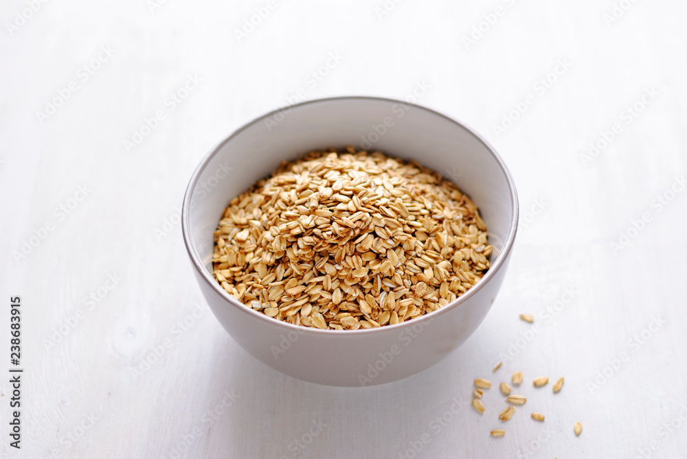 White bowl of dry oatmeal White bowl of dry oatmeal