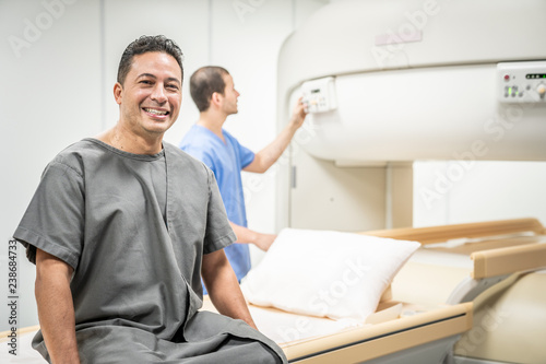 Portrait Of Happy Man Smiling As Patient In Clinic