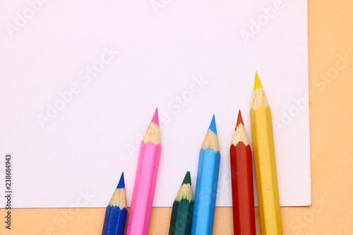 colored pencils and a clean sheet of paper