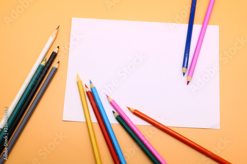 colored pencils and a clean sheet of paper