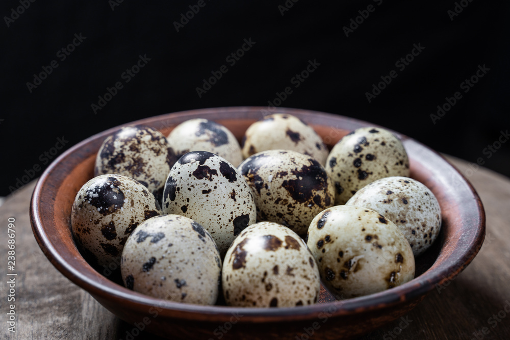 natural organic quail eggs on a wooden table natural organic quail eggs on a wooden table