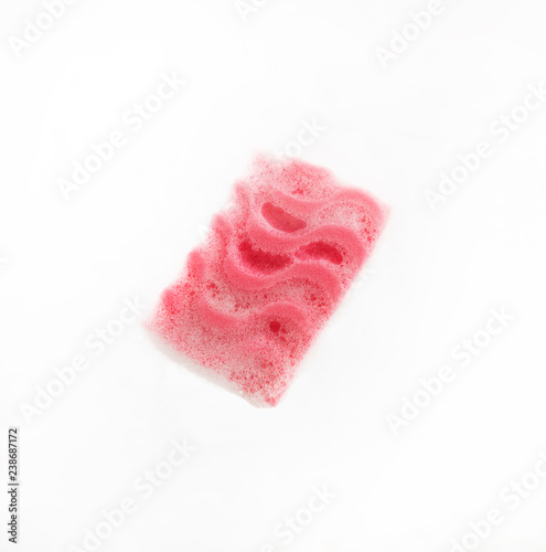 Sponge with soap sud on glass isolated