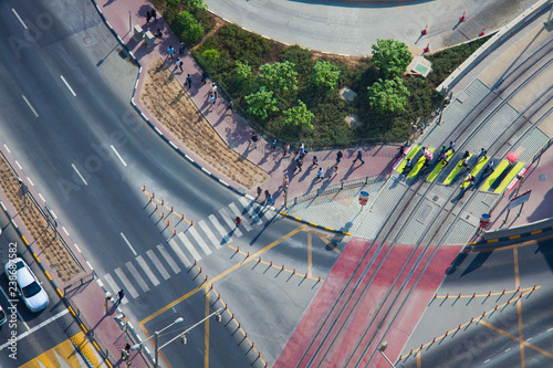 Photography people crossing the road on zebra, city center of Dubai