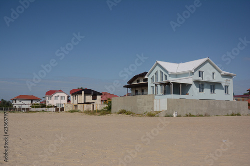Modern houses on the sea sand beach