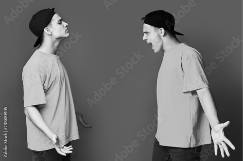 Photo Split personality. Guy having conflict with himself