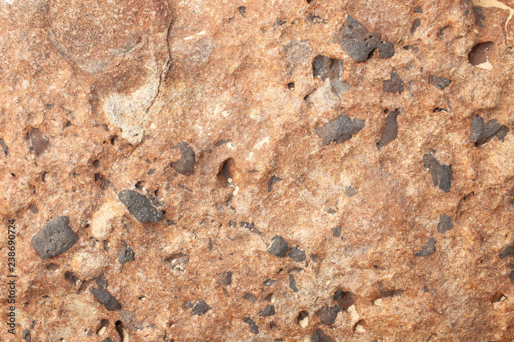 Red stone texture with turn-down black stones Red stone texture with turn-down black stones