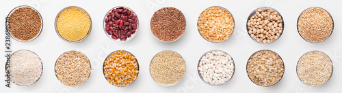 Collection of various grains in bowls isolated on white photo