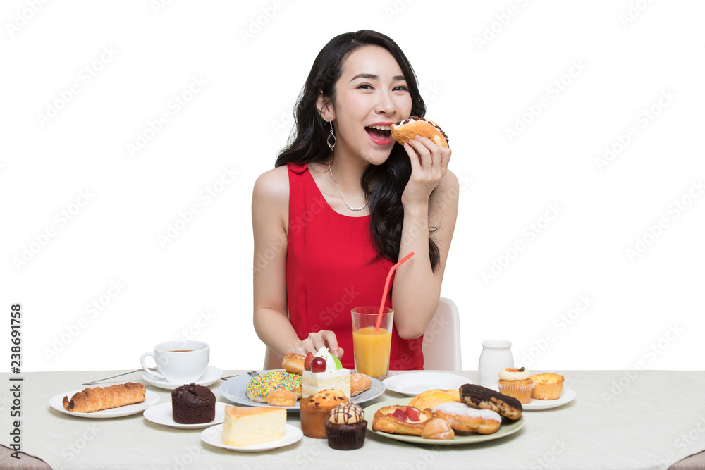Fashionable young woman eating dessert Fashionable young woman eating dessert