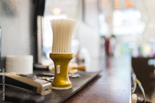 The brush is hanging in the barber shop, Shaving accessories in a barber shop,