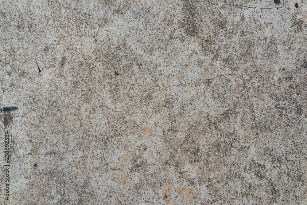Closeup fragment of grunge weathered wall of a building, Aged cracked concrete stone plaster wall background and texture style Closeup fragment of grunge weathered wall of a building, Aged cracked concrete stone plaster wall background and texture style