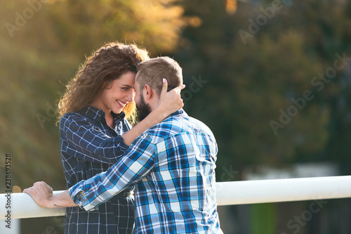 Young couple in love hugging and looking at each other