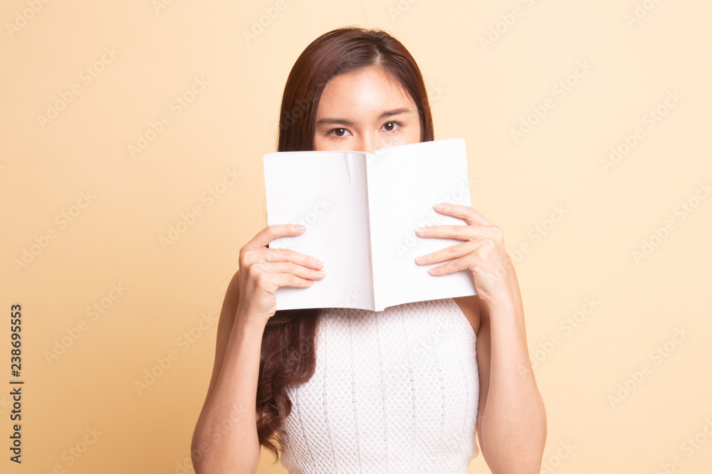 Young Asian woman with a book. Young Asian woman with a book.