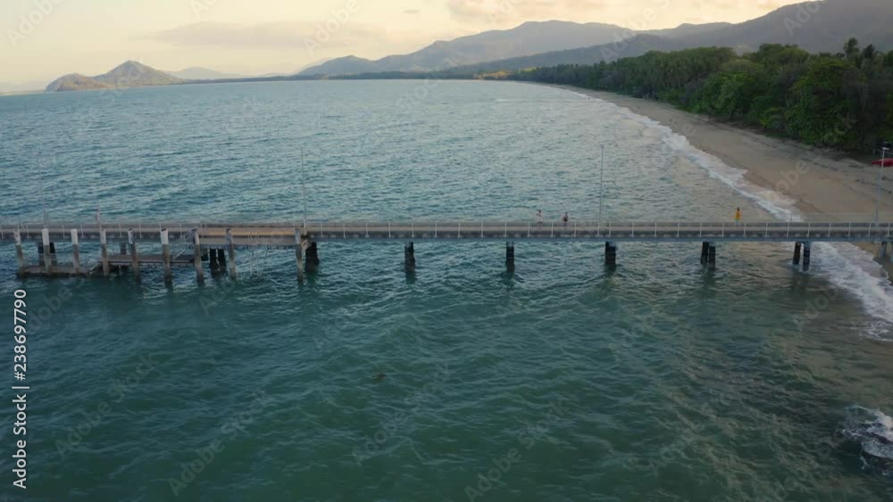 Aerial, beautiful seascape and a pier and beach with tropical vegetation in Palm Cove, Queensland, Australia Aerial, beautiful seascape and a pier and beach with tropical vegetation in Palm Cove, Queensland, Australia