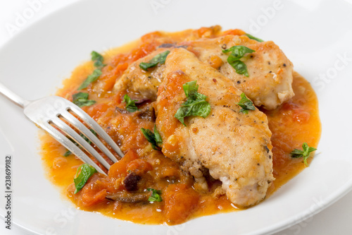 Provencal chicken breast meal with a fork