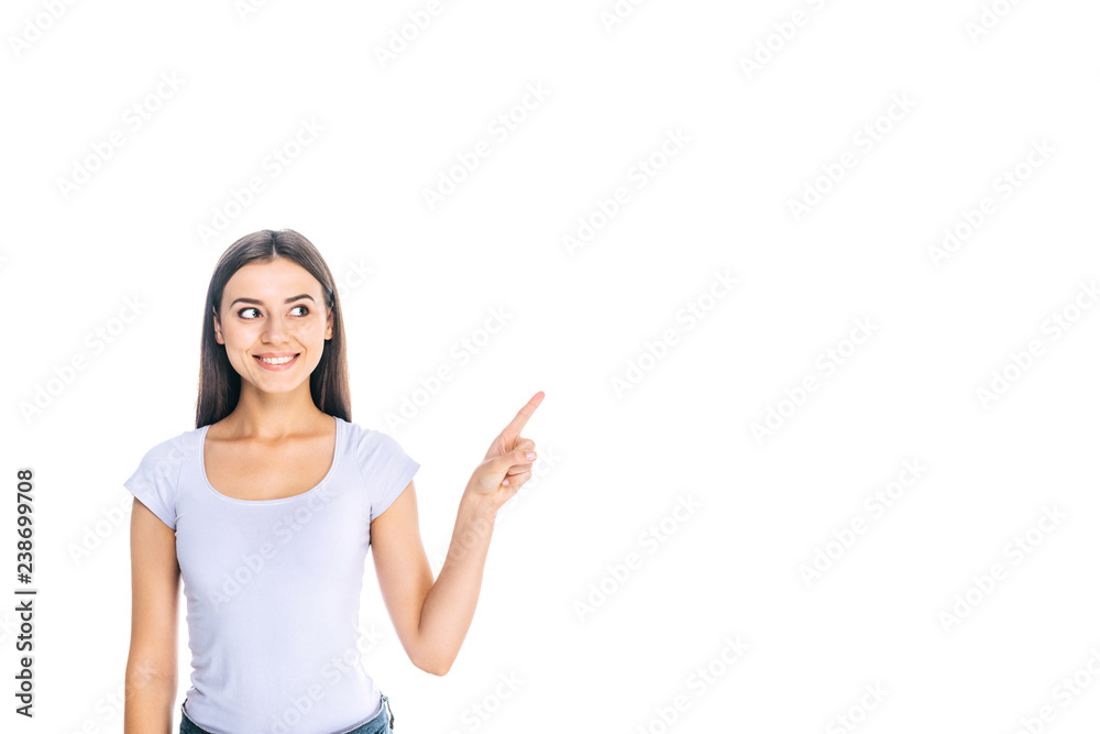 portrait of smiling young woman pointing away isolated on white portrait of smiling young woman pointing away isolated on white