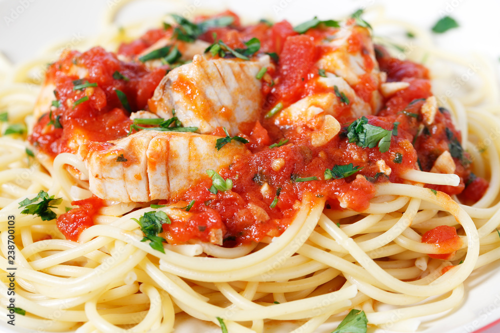 Spaghetti all'arrabbiata with fish side view Spaghetti all'arrabbiata with fish side view