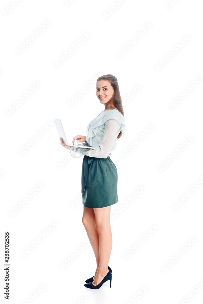 side view of smiling young woman with laptop isolated on white side view of smiling young woman with laptop isolated on white