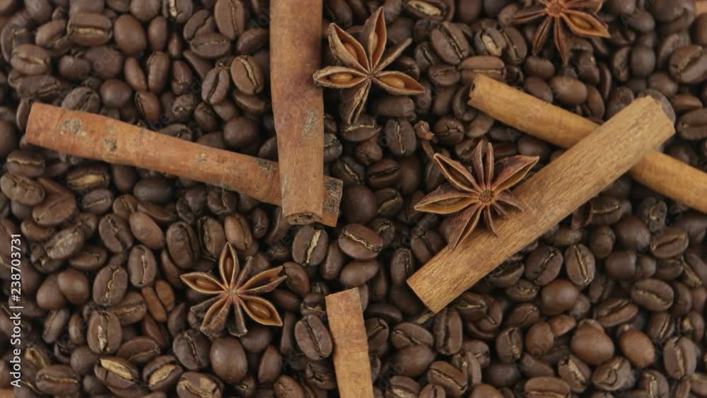 Composition of the cinnamon sticks, anise stars and roasted beans of coffee, background Composition of the cinnamon sticks, anise stars and roasted beans of coffee, background