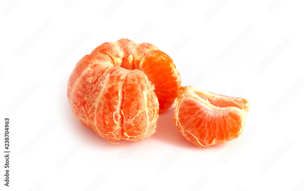 Unpeeled mandarin, isolated on white background