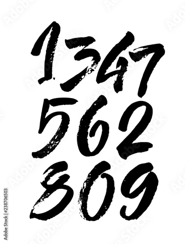 set of calligraphic acrylic or ink numbers. ABC for your design, brush lettering on a black background