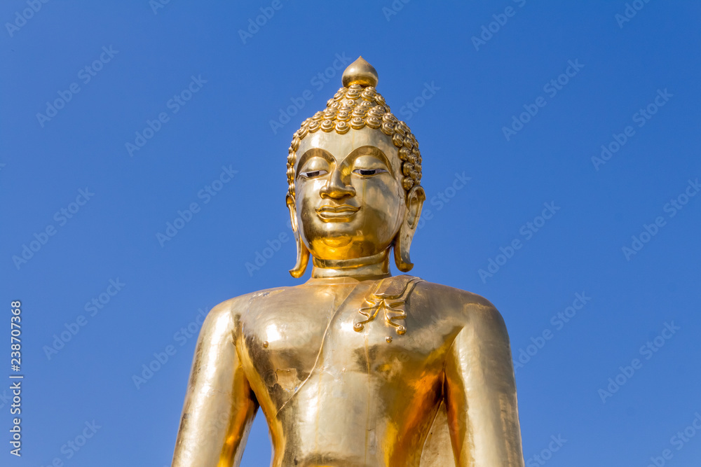 Golden Buddha statue with clear sky background in Golden Triangle, Sop Ruak, Thailand